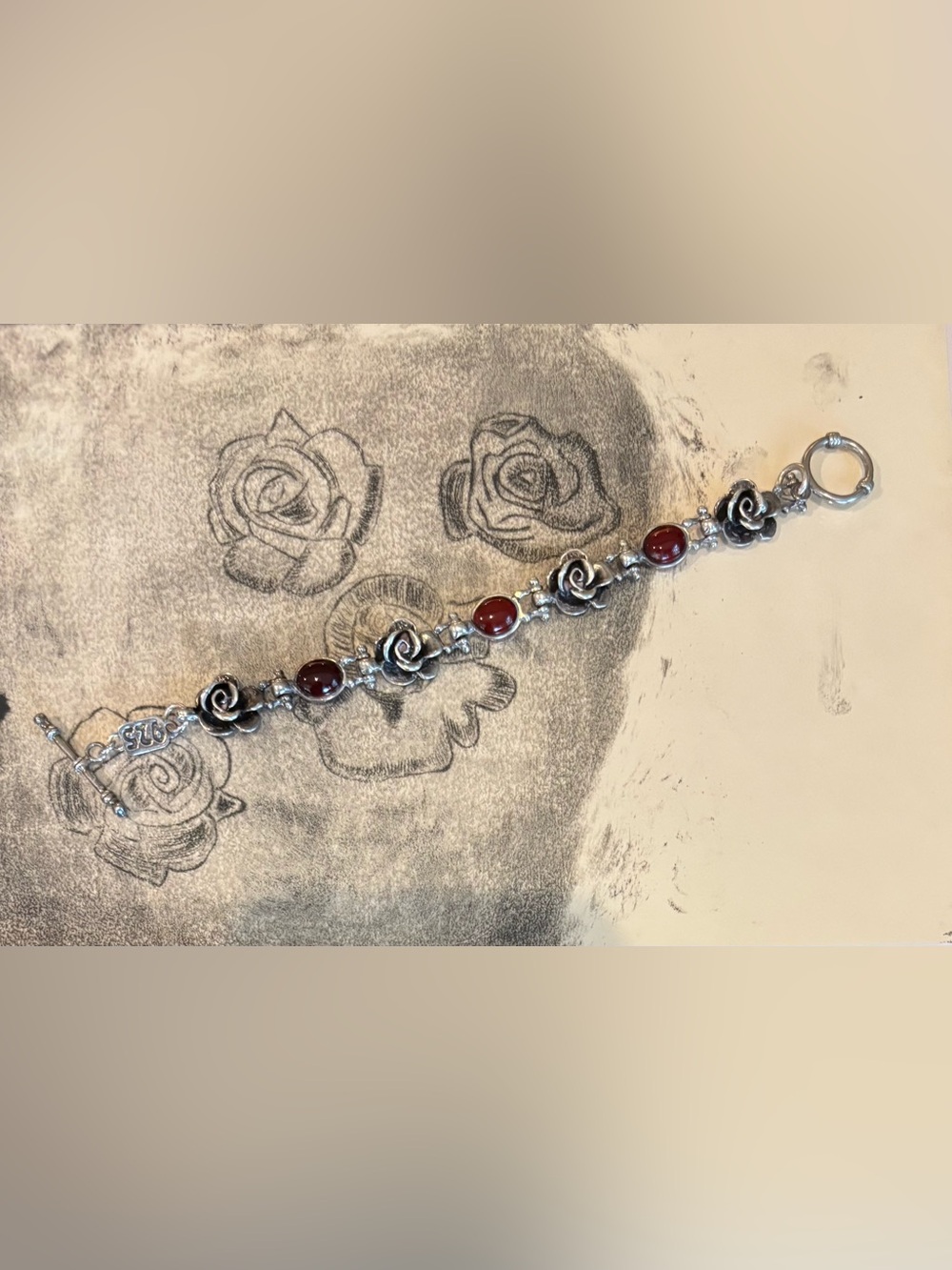 Sterling Silver Rose Link Bracelet with cabochon amber Stones.